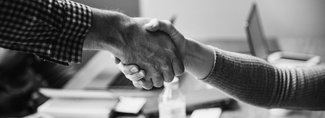 Business people shaking hands in agreement Business people shaking hands in agreement